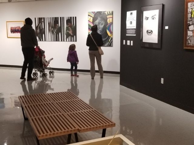 family looking at art