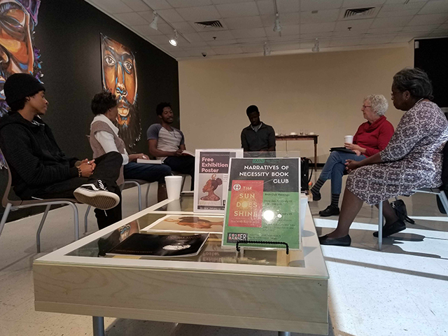 family looking at art